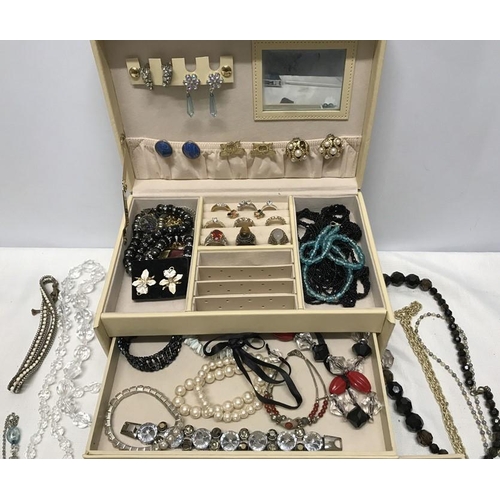 752 - A leather jewellery box and contents of costume jewellery, rings, beaded necklaces, bracelets, earri... 