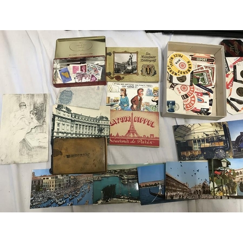 769 - Album of cigarette packets, collection of beer bottle labels, stamps and European postcards.