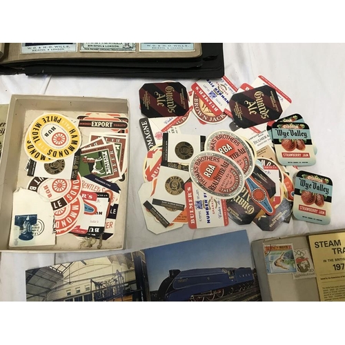 769 - Album of cigarette packets, collection of beer bottle labels, stamps and European postcards.