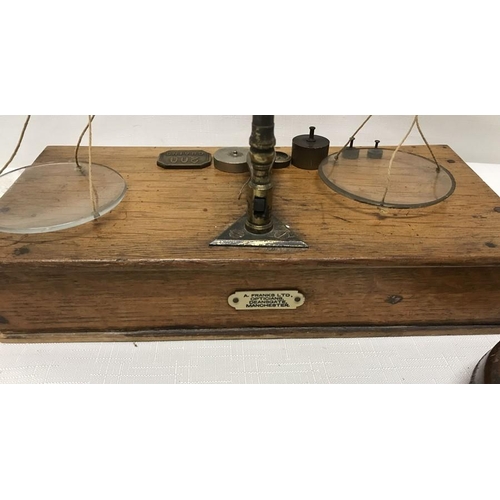 8 - Brass set of balance scales with oak drawer base, label to the back for A Franks Ltd Opticians, 33cm... 