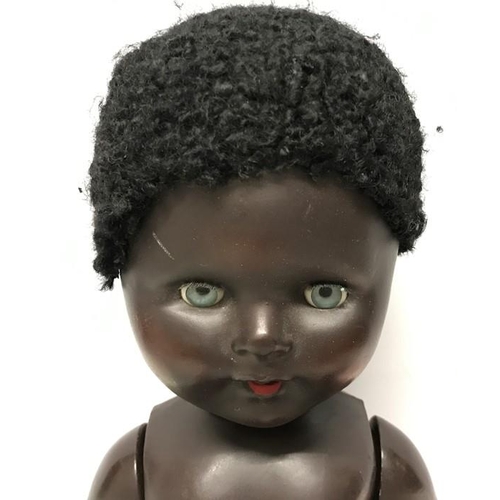 837 - Large composition black doll, blue eyes and crying sound box, makers mark FP 23, approx 58cms h, som... 