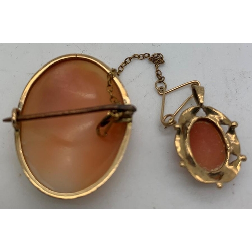 85 - A shell cameo brooch with safety chain set in 9 ct gold mounts 3 x 2.5cms approx together with shell... 