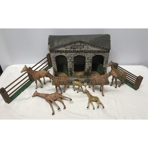 850 - German Elastolin Giraffes and Giraffe house 32 w x 23cms h, seven giraffes, tallest 17cms h with 2 f... 