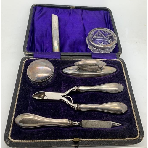 88 - Cased silver and steel manicure set Birmingham 1912/13, a silver topped glass salt and a cocktail st... 