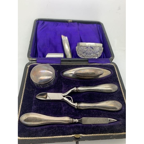 88 - Cased silver and steel manicure set Birmingham 1912/13, a silver topped glass salt and a cocktail st... 