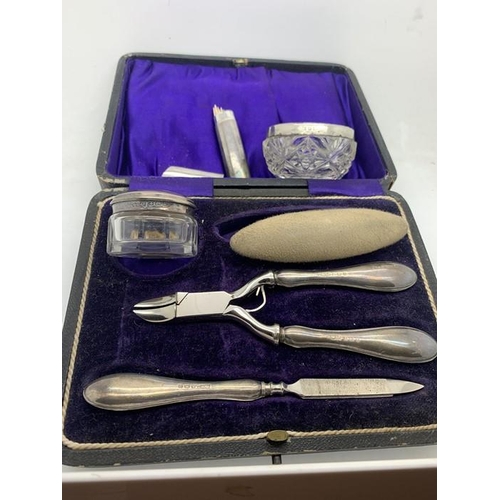 88 - Cased silver and steel manicure set Birmingham 1912/13, a silver topped glass salt and a cocktail st... 