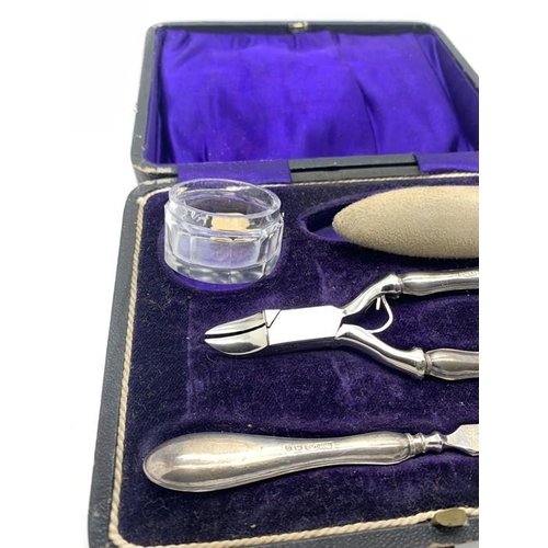 88 - Cased silver and steel manicure set Birmingham 1912/13, a silver topped glass salt and a cocktail st... 