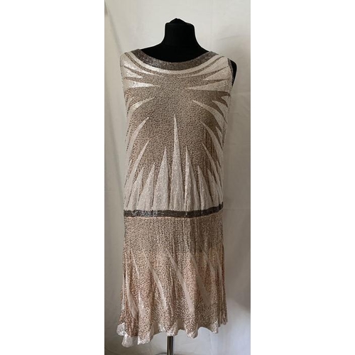 91 - A vintage French beaded evening dress, labelled Made in France, 44. 99cms l, under arm to arm laid f... 