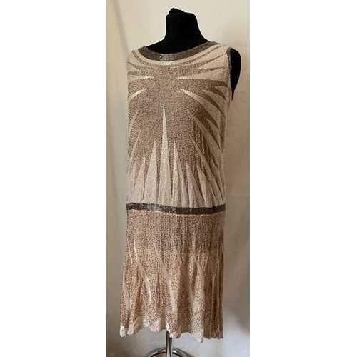 91 - A vintage French beaded evening dress, labelled Made in France, 44. 99cms l, under arm to arm laid f... 