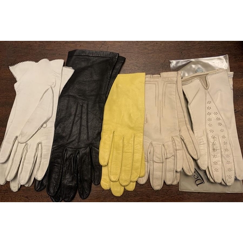 95 - Eleven pairs of vintage kid leather suede gloves to include long evening gloves.