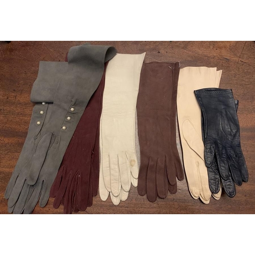 95 - Eleven pairs of vintage kid leather suede gloves to include long evening gloves.