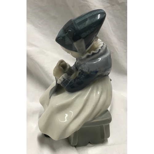 200e - Royal Copenhagen Denmark figurine, Amager girl sewing 16cms h x 11cms w, signed to the base. Model n... 