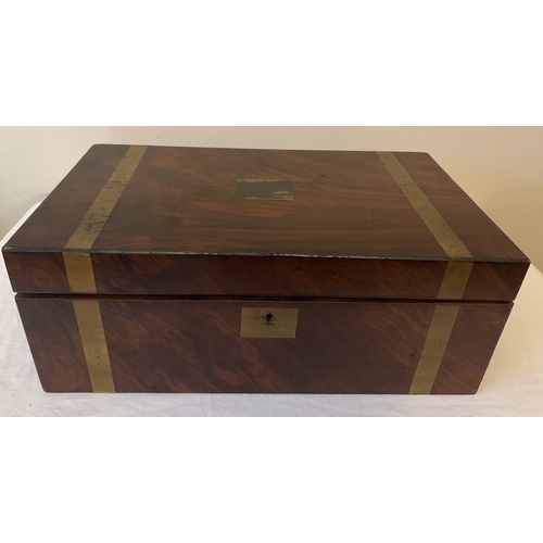 1271 - A Victorian mahogany brass bound lap desk with tooled leather writing slope. Two original inkwells a... 