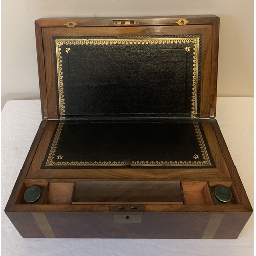 1271 - A Victorian mahogany brass bound lap desk with tooled leather writing slope. Two original inkwells a... 