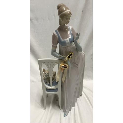 250b - Large Lladro figurine. Young lady with small dog 47cms h, base 20 w x 31cms d.