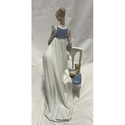 250b - Large Lladro figurine. Young lady with small dog 47cms h, base 20 w x 31cms d.