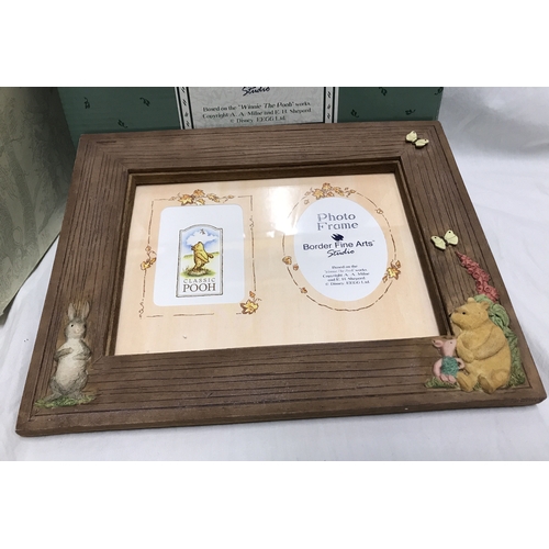 250C - Border Fine Arts Winnie the Pooh classics. Photo frame 26 w x 21cms h and a mini canister Pooh sat o... 