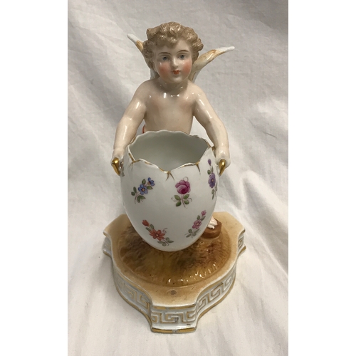 255A - Sitzendorf porcelain cherub carrying a floral painted egg, 18cms h, base width 11cms.