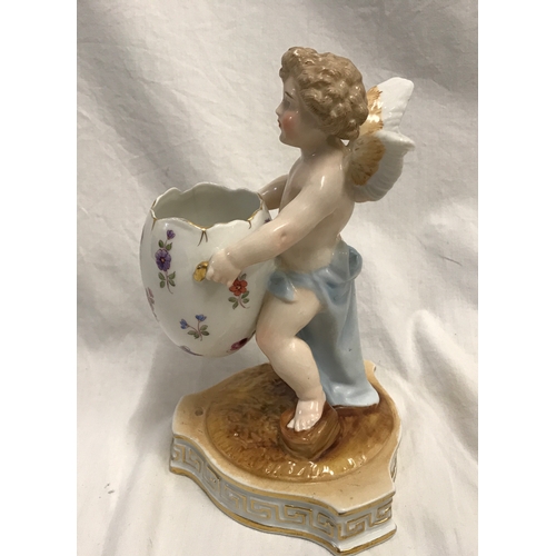 255A - Sitzendorf porcelain cherub carrying a floral painted egg, 18cms h, base width 11cms.