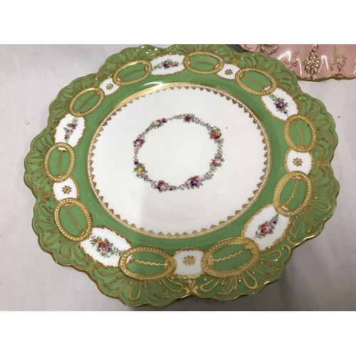 255G - Three decorative plates, Royal Crown Derby Vine pattern, pink and gilt border with floral panel 22cm... 