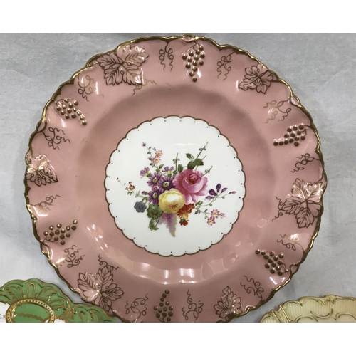 255G - Three decorative plates, Royal Crown Derby Vine pattern, pink and gilt border with floral panel 22cm... 