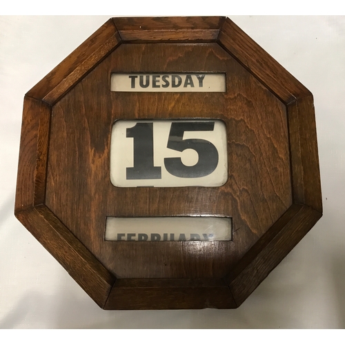 1203 - Two vintage oak framed wall mounted perpetual wall calendars, both with rolling day/date/month.