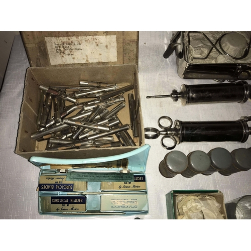 1212 - Vintage surgical equipment including WW II, cased ophthalmoscope Brady & Martin, surgical needles, a... 