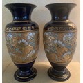Nineteenth century Doulton Slaters lace work decorated vases. 34cms h.