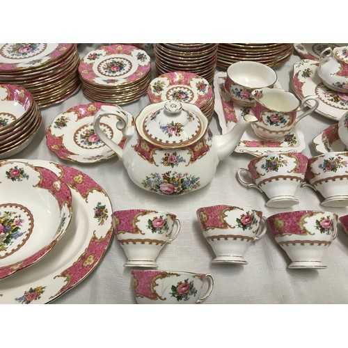 11 - Royal Albert Lady Carlyle tea and dinner ware. Pink ground floral design with gilt border. 129 piece... 