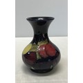 A Moorcroft plum design vase 15.5cm with made in England and Moorcroft marked to base with signature... 