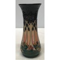 A Moorcroft Sally Tuffin-Cluny design slender baluster vase of tree/forest design c1990 21cm. Marked... 