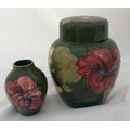 A Moorcroft ginger jar 16cm h , green ground and a small Moorcroft vase 9cm h.