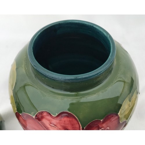 37 - A Moorcroft ginger jar 16cm h , green ground and a small Moorcroft vase 9cm h.