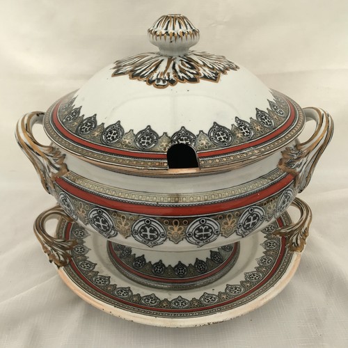39 - A Victorian lidded tureen on a plate stand. J. & M.P. & Co Ltd. Bracelet design. Stands on plate 29c... 