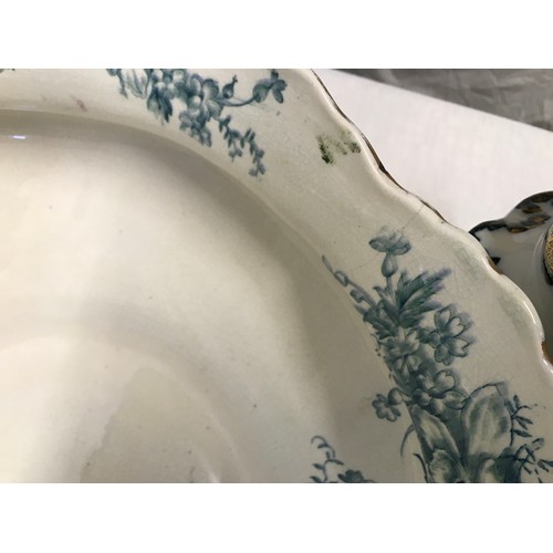 57 - A jug and washbowl set in a blue and white floral pattern. Ten pieces. T.R and Co Derby.