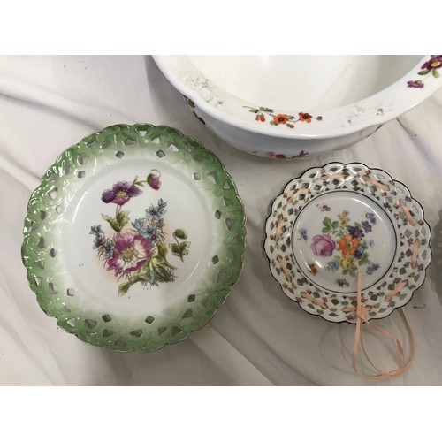 60 - A collection of four ribbon plates to include a present from Warblethorpe 22.5cm w, one with a flora... 