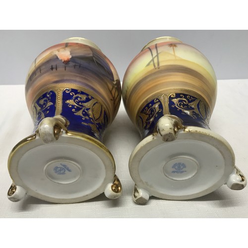 74 - A pair of Japanese Noritake decorative vases 25cm h with blue ground gilded with scenes of Arabian D... 