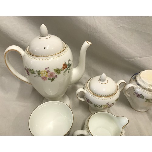 92 - A Wedgwood Mirabelle tea and coffee set to include a coffee pot, a teapot, 2 lidded pots, 2 cream ju... 