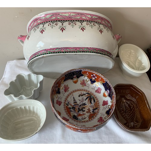 96 - Four late 19thC/early 20thC ceramic jelly moulds, a 19thC footbath 53cms x 34cms and an Imari patter... 