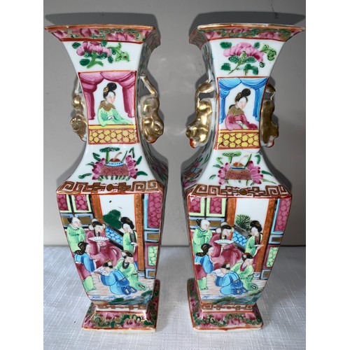 100 - A garniture of four 19thC Chinese famille rose Mandarin pattern tallest 23cms h.