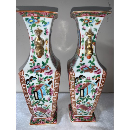 100 - A garniture of four 19thC Chinese famille rose Mandarin pattern tallest 23cms h.