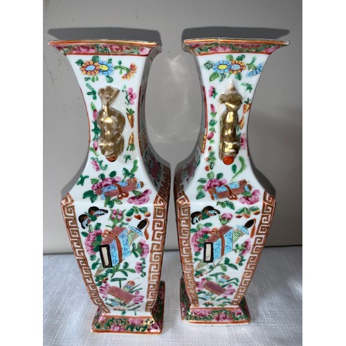 100 - A garniture of four 19thC Chinese famille rose Mandarin pattern tallest 23cms h.