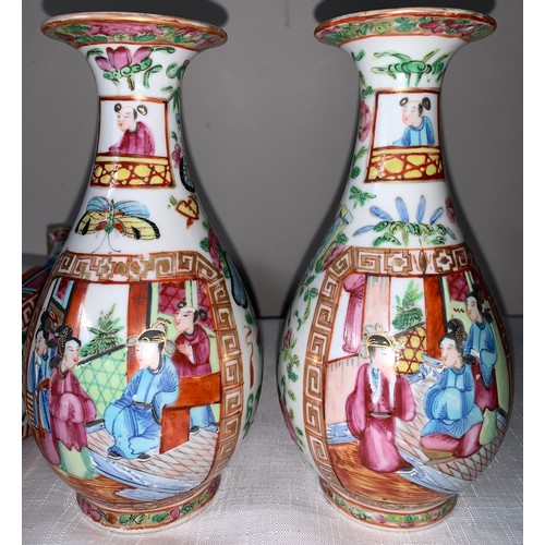 100 - A garniture of four 19thC Chinese famille rose Mandarin pattern tallest 23cms h.