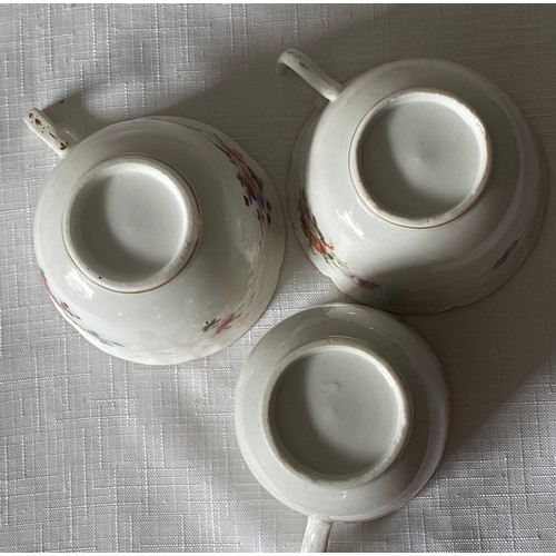 103 - Three early 19thC porcelain floral decorated cups and saucers possibly Swansea.