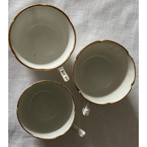 103 - Three early 19thC porcelain floral decorated cups and saucers possibly Swansea.