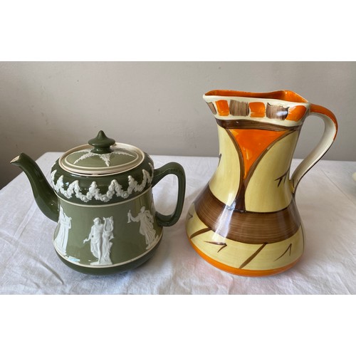 110 - A selection of ceramics to include a green Carlton Ware teapot, a hand painted Myott & Son jug, a ha... 