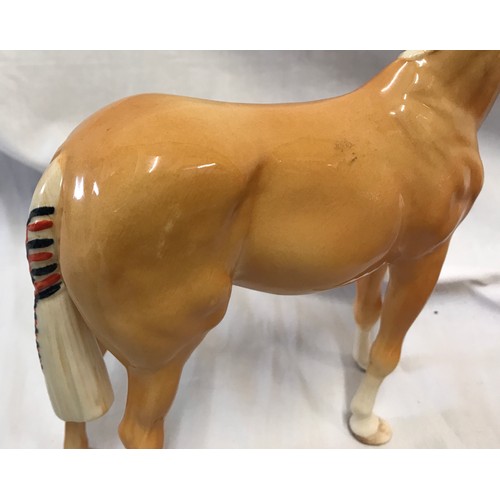 114 - A pottery selection to include a Beswick light brown horse 16.5cms , a Beswick black and white Colli... 