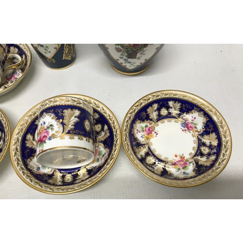 118 - A Cauldron Ltd floral and gilt painted part tea set to include 5 cups 5.5cms h, 6 saucers 11cms d, a... 