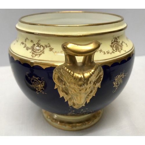 119 - A Coalport signed blue ground and gilt lidded vase with a painted panel of a country scene near Dove... 