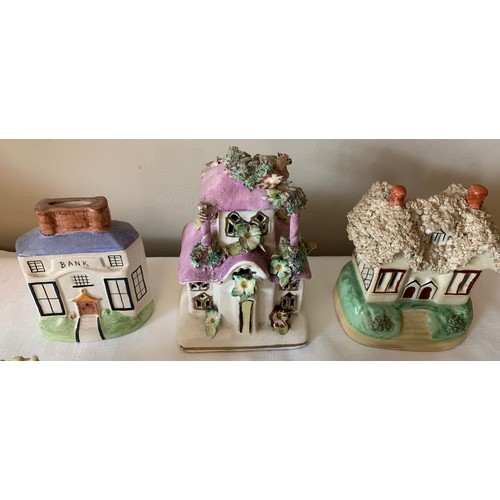 121 - Ten Staffordshire cottages to include money boxes and pastille burners, some 19thC.